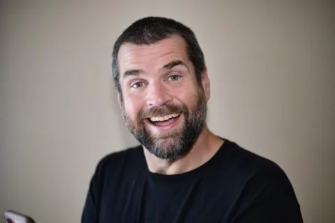 IT Guy on Smartphone - Happy and Smiling Foto stock