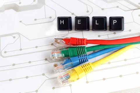 IT help, assistance, network cables circuit board background Stock Photos