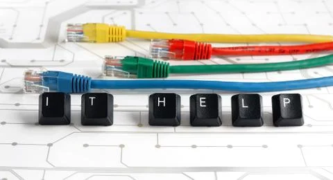 IT help, assistance, network cables circuit board background Stock Photos