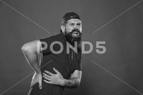 It hurts so much. barista tired and lower back pain after work. need body Stock Photos