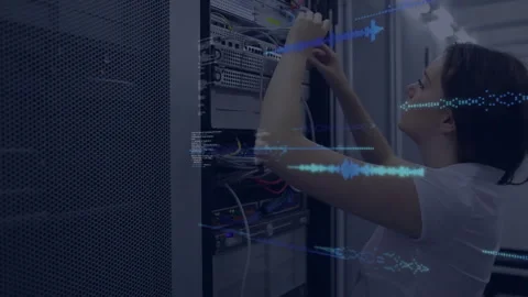 IT intern inserting ethernet cable into patch port, generating code overlays Stock Footage 309894220