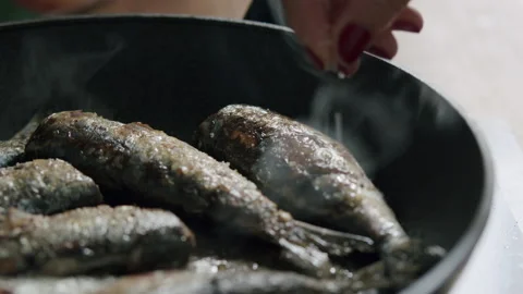 It just needs a pinch of salt and seafood dinner is ready Stock Footage 144887818