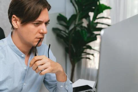 IT looking at online software development on pc align working laptop. Pecuniary. 스톡 사진