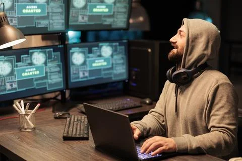IT male hacker using computer to break system Stock Photos