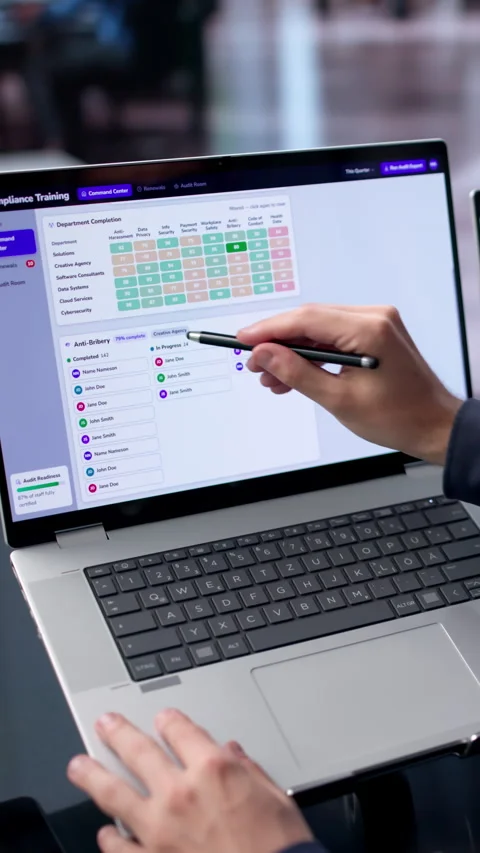 IT Manager Reviews Compliance Dashboard On Dual Touchscreen Laptop Stock Footage 340399549