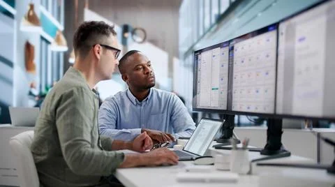 IT Managers Collaborate On Secure Cloud Document System Using Laptops Efficie Stock Photos