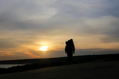 It is a mans world with sunset Stock Photos