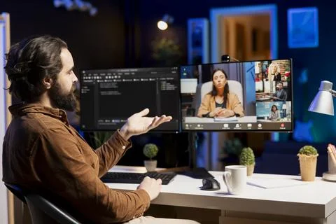 IT master teaching apprentices in webinar how to write code 写真素材