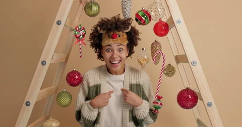 Is it my merit really? Positive overjoyed Christmas woman points at herself Stock Footage 144053877