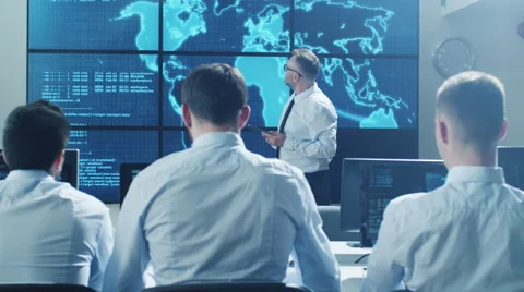 IT network Security Professional Giving Presentation to his Colleague Stock Footage 64484443