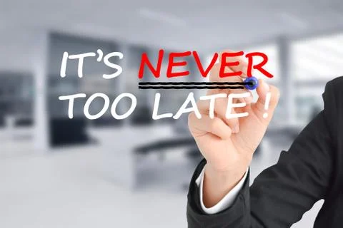 It is never too late text with businesswoman hand writing Stock-Fotos