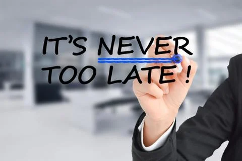 It is never too late text with businesswoman hand writing Stock-Fotos