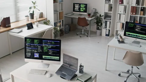 IT Office with Computers Running Code Placed on Developer Stations Stock Footage 330123982