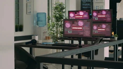 IT office with multiple monitors showing critical error message flashing on Stock Footage 231846737