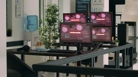 IT office with multiple monitors showing critical error message flashing on Stock Photos