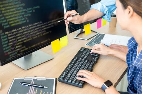 IT office Programmers software development coding technologies On Computer wo Stock Photos