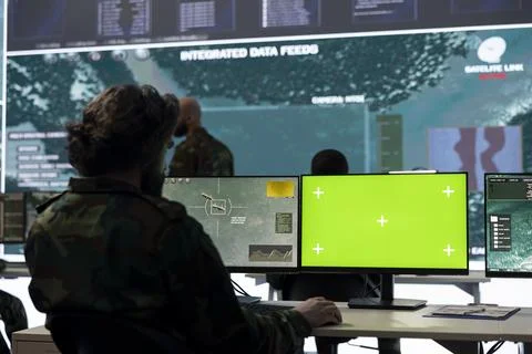 IT operator works with isolated display and tracking hostile vessels 库存照片