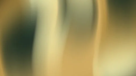 It presents blurred gold and green vertical streaks. Stock Footage 310058545
