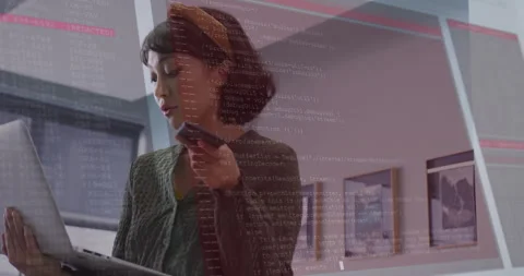 IT pro holding laptop and raising smartphone speaking activating red code Stock Footage 314368161
