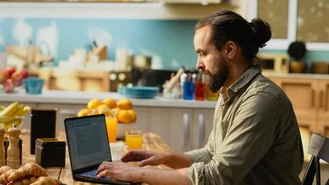 IT professional coding on laptop representing remote work 写真素材
