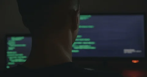 IT professional hacker programmer is working on computer in cyber security Stock Footage 95497967