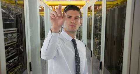 IT professional managing servers in data center, focusing on network maintenance 스톡 사진
