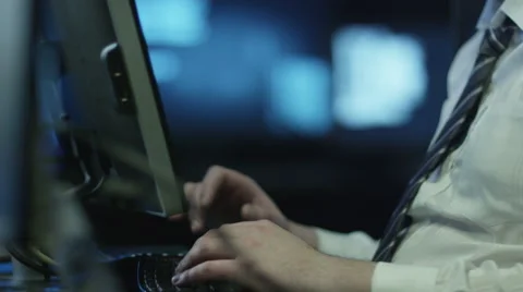 IT professional programmer is working on computer in dark office room Stock Footage 59382597