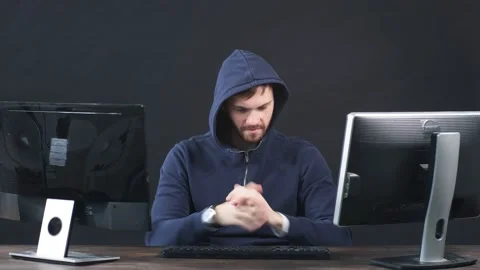 IT professional programmer is working on computer in dark office room Stock Footage 124519148