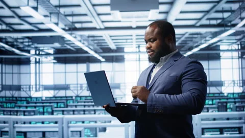 IT professional in server room looking for network issues Stock Footage 277657471