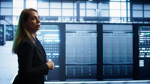 IT professional supervising data center workplace, checking hardware 스톡 사진