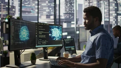 IT professional working with AI tech to transform data into predictive models Stock Footage 318236946