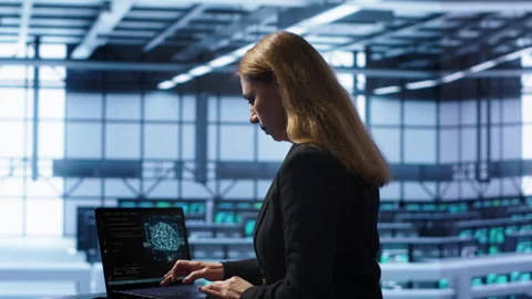 IT professional working on notebook with AI machine learning algorithms 動画素材 277647212