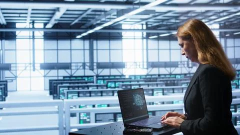 IT professional working on notebook with AI machine learning algorithms 写真素材
