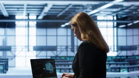 IT professional working on notebook with AI machine learning algorithms Stock Photos