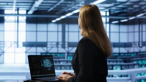 IT professional working on notebook with AI machine learning algorithms Stock Photos