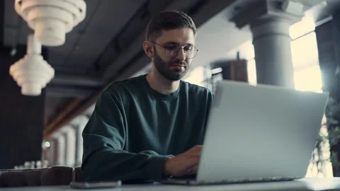 IT Professional Writing Program Code, Portrait Of Freelancer Working With Video stock 343409057