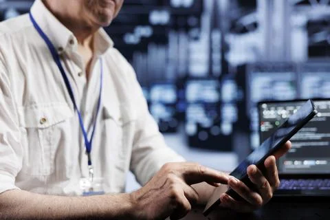 IT programmer coding in data center Stock Photos