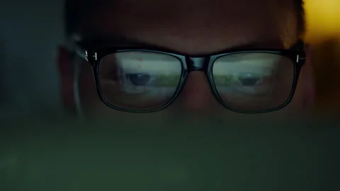 IT programmer, a man with glasses, works at night with a portable laptop. Hi Stock Footage 256164815