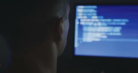 IT Programmer man typing in program code. Developer at work overtime. Hacker Stock Footage 95689954
