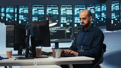 IT programmer safeguarding supercomputers against unauthorized access Stock Footage 275486252