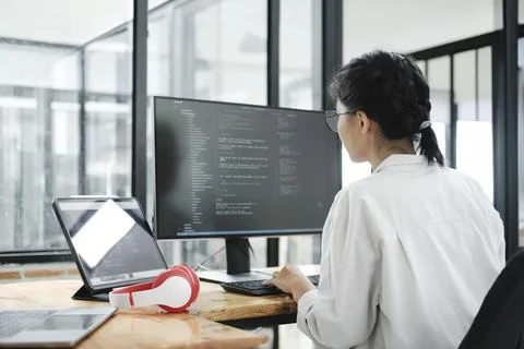 IT Programmer Starts Working on Desktop Computer. Stock Photos