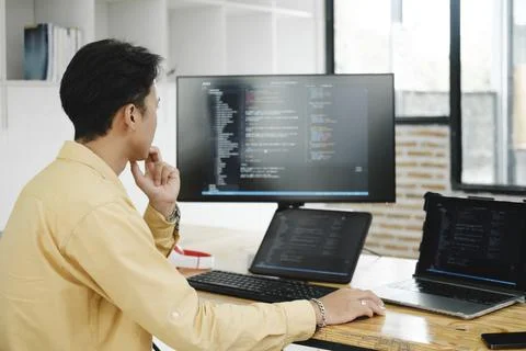 IT Programmer Starts Working on Desktop Computer. Stock Photos