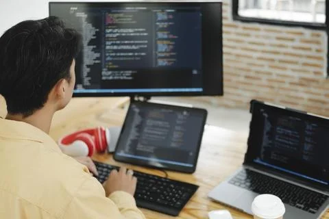 IT Programmer Starts Working on Desktop Computer. 写真素材