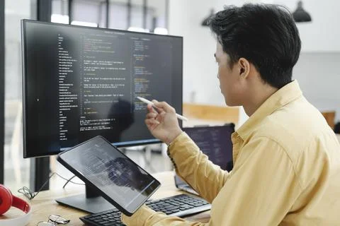 IT Programmer Starts Working on Desktop Computer. Stock Photos