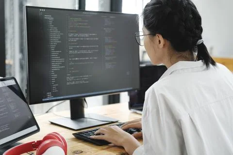 IT Programmer Starts Working on Desktop Computer. 스톡 사진