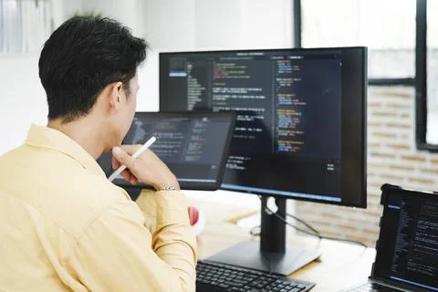 IT Programmer Starts Working on Desktop Computer. Stock Photos