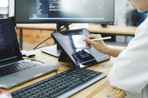 IT Programmer Starts Working on Desktop Computer. Stock Photos
