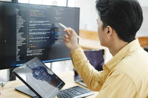 IT Programmer Starts Working on Desktop Computer. Stock Photos