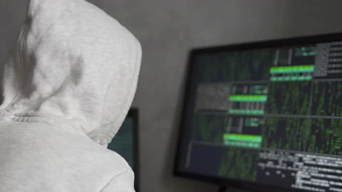 IT programmer working on a computer in a technical system control room. Stock Footage 220648323