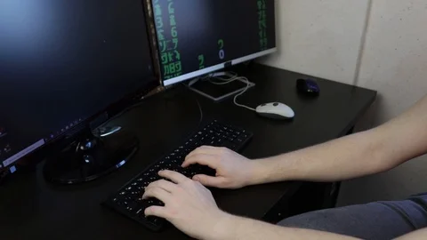  IT Programmer works at the computer typing code Stock Footage 121473079